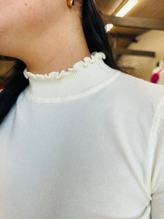 FRILLY MOCK NECK